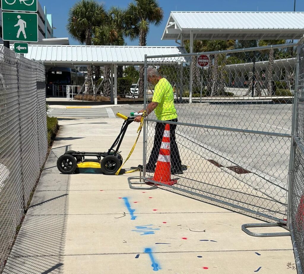Venegroup ENG technician performing underground utility locating in Florida